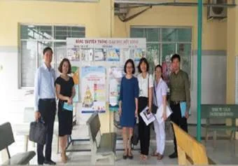 A group of people standing in front of a posterAI-generated content may be incorrect.